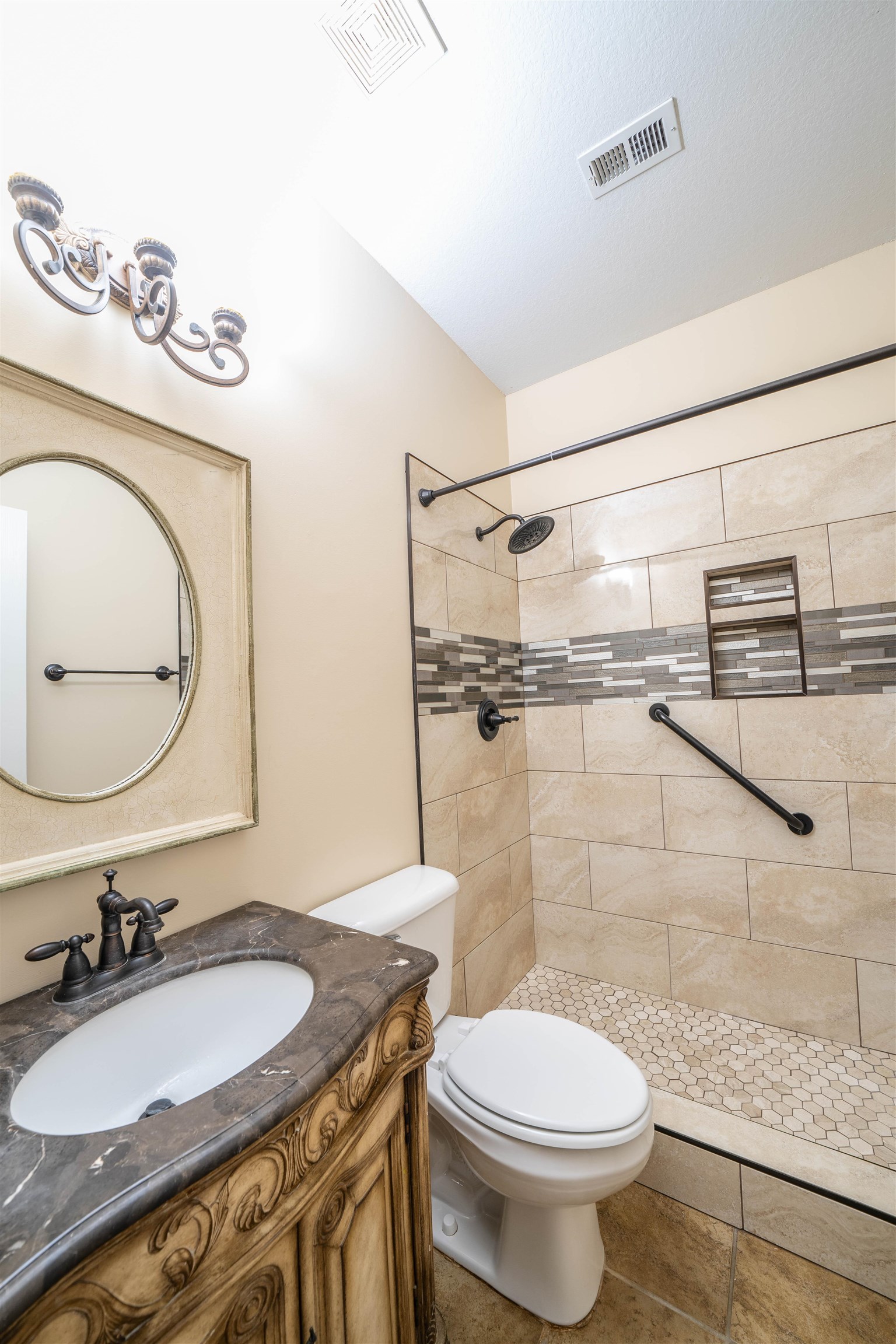 3740 Charles Bartlett Road Millington, TN 38053 - Photo 22 of 36 a bathroom with a granite countertop toilet sink and mirror