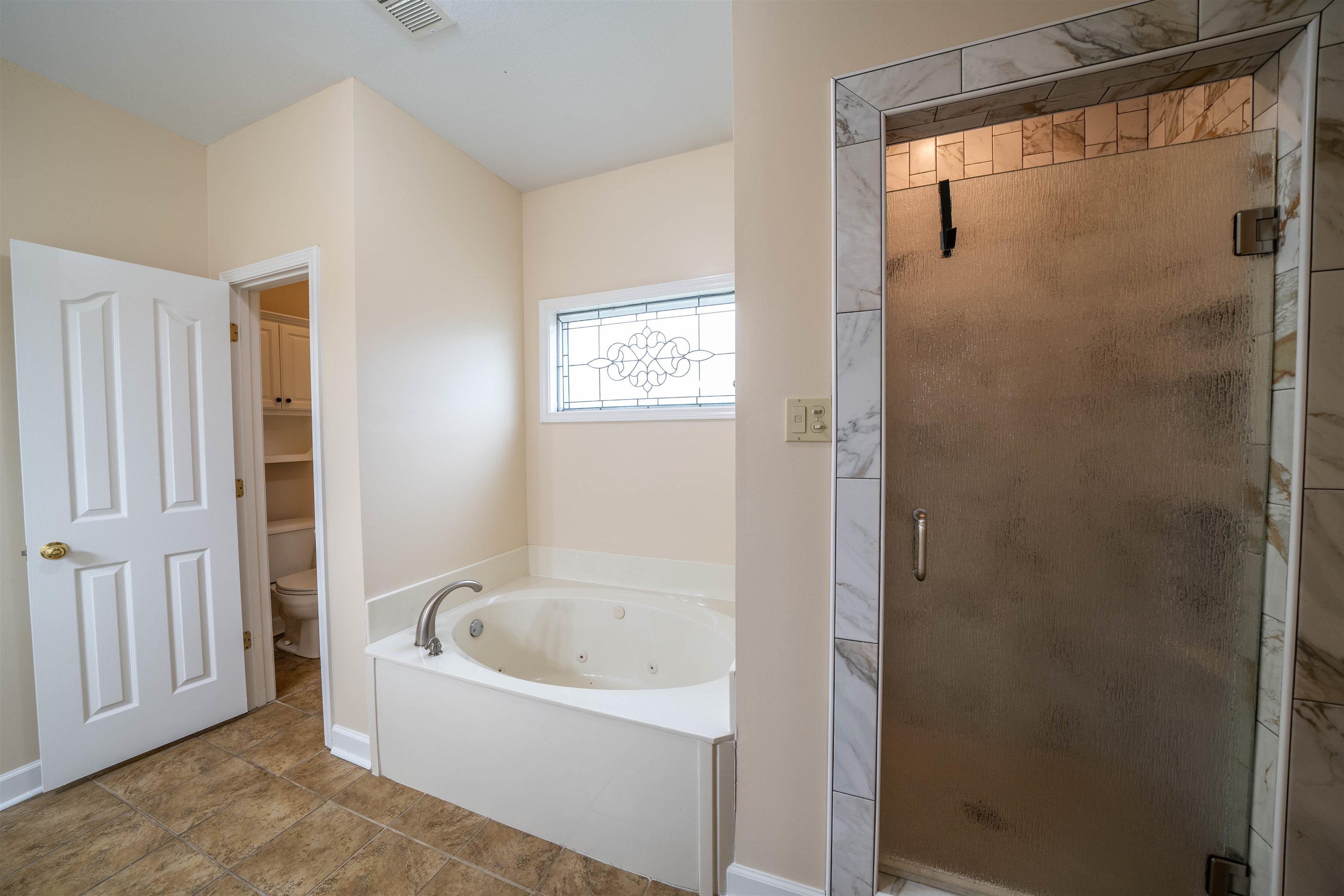 3740 Charles Bartlett Road Millington, TN 38053 - Photo 26 of 36 a white bath tub sitting next to a shower