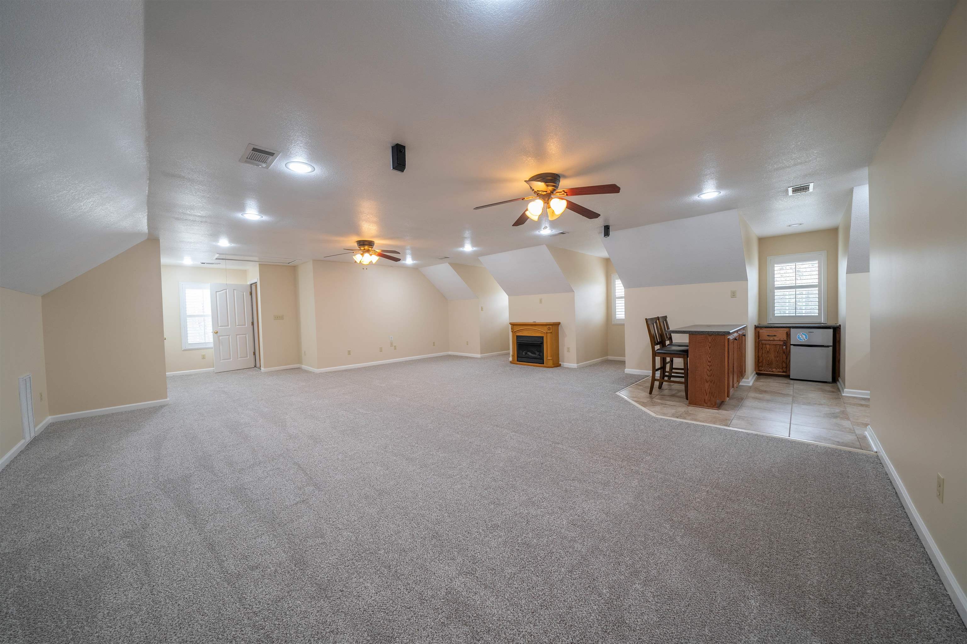 3740 Charles Bartlett Road Millington, TN 38053 - Photo 31 of 36 a view of a livingroom with furniture and a chandelier fan