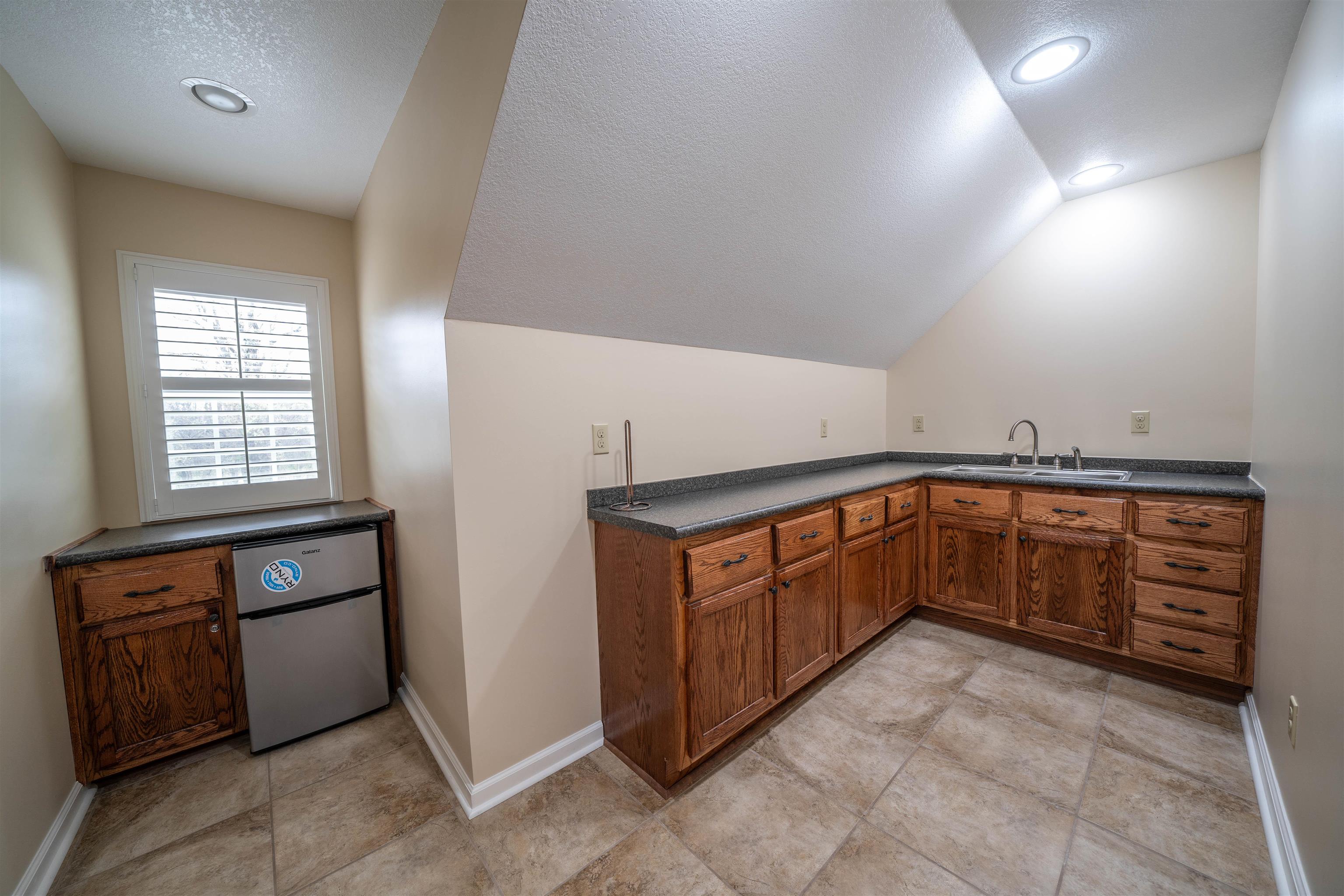3740 Charles Bartlett Road Millington, TN 38053 - Photo 32 of 36 a kitchen with stainless steel appliances granite countertop a stove and a sink
