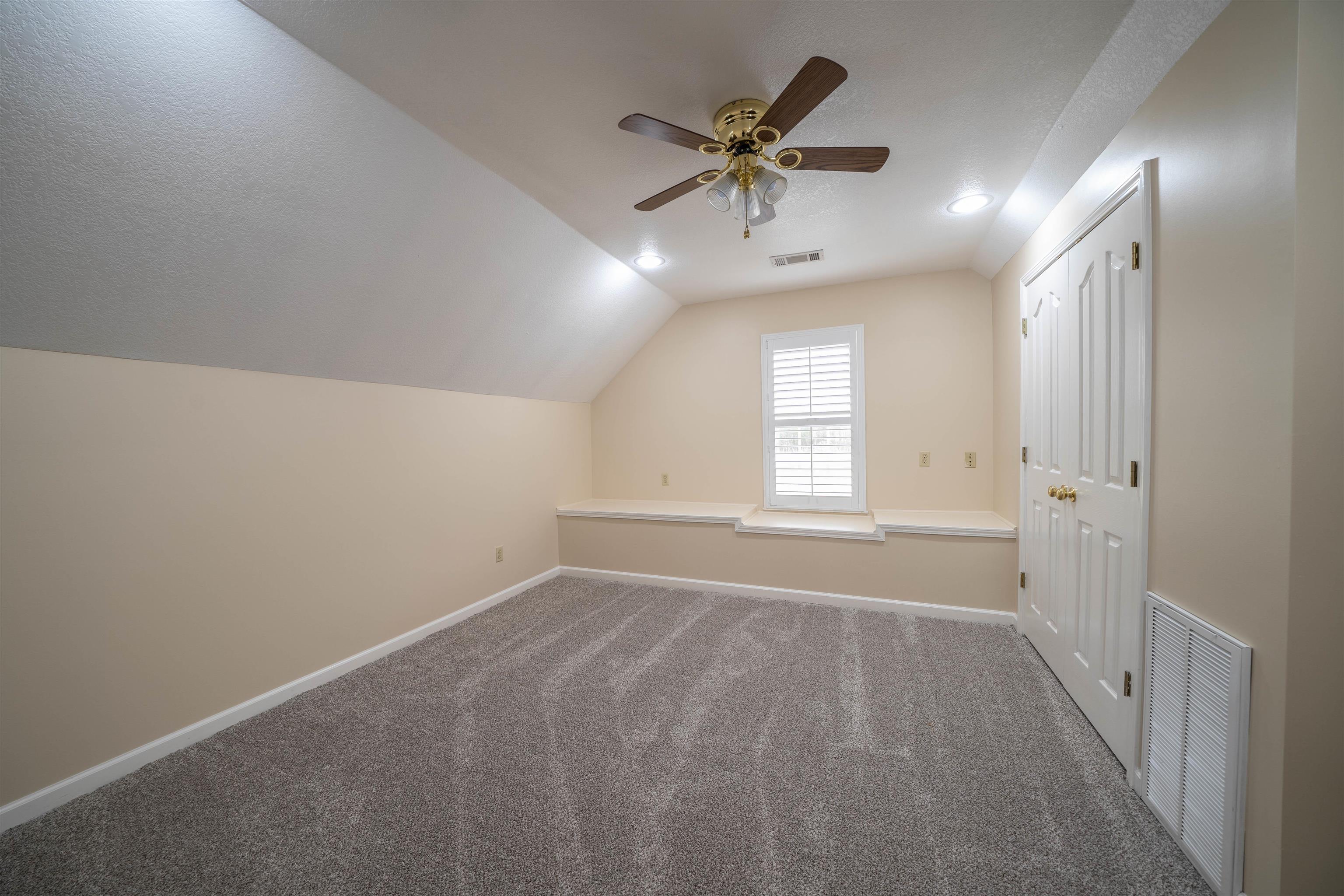 3740 Charles Bartlett Road Millington, TN 38053 - Photo 34 of 36 an empty room with windows and fan