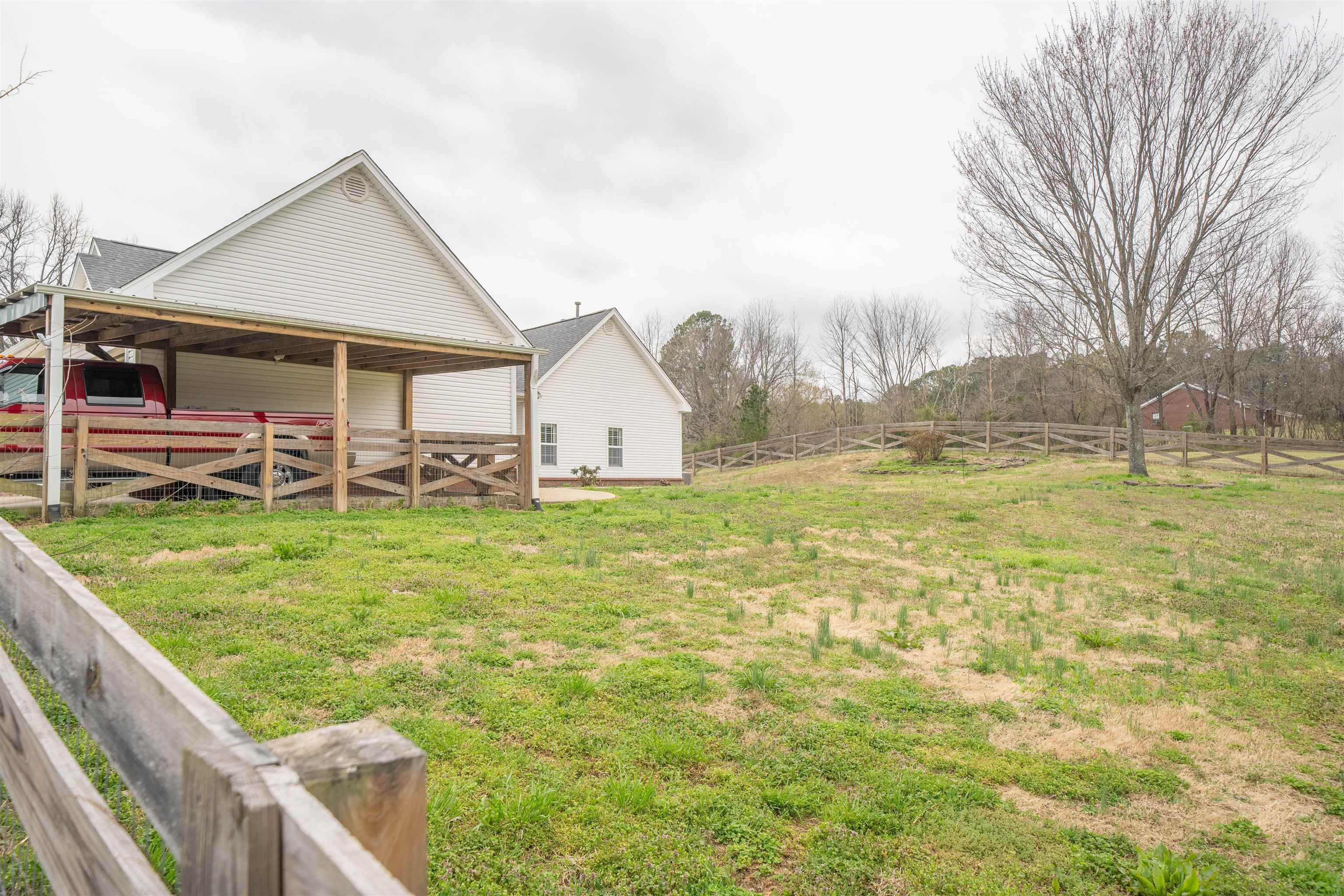 3740 Charles Bartlett Road Millington, TN 38053 - Photo 7 of 36 a view of a house with garden and a yard