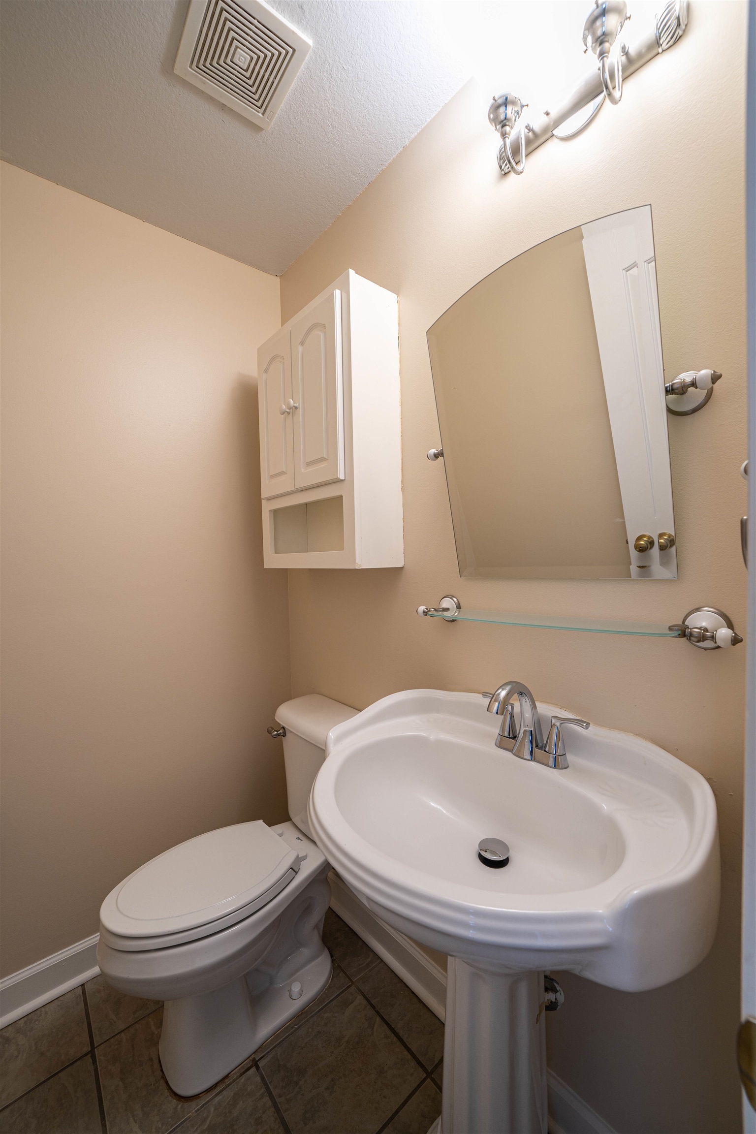 3740 Charles Bartlett Road Millington, TN 38053 - Photo 8 of 36 a bathroom with a sink a toilet and mirror