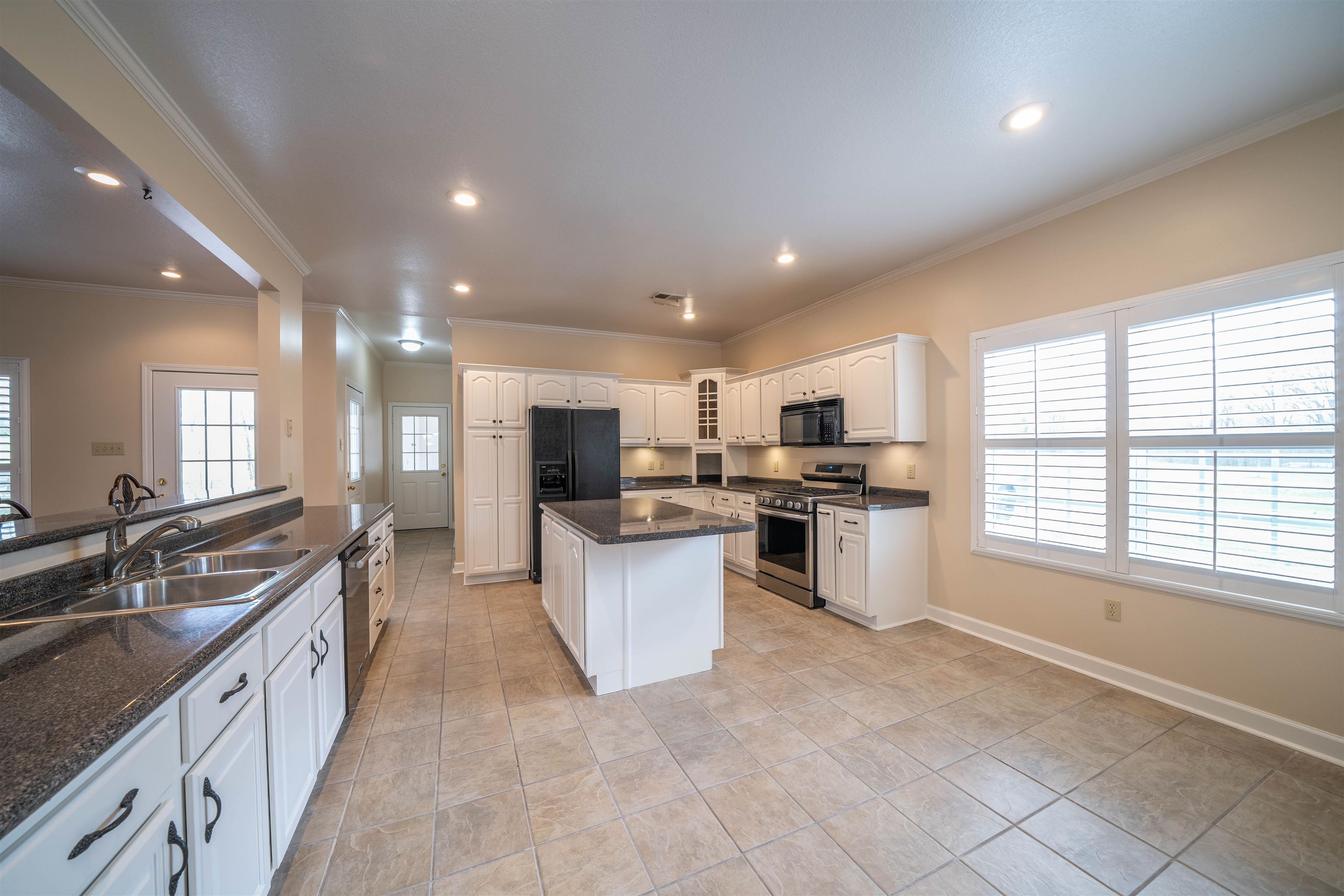 3740 Charles Bartlett Road Millington, TN 38053 - Photo 10 of 36 a large kitchen with stainless steel appliances lots of counter space and a sink