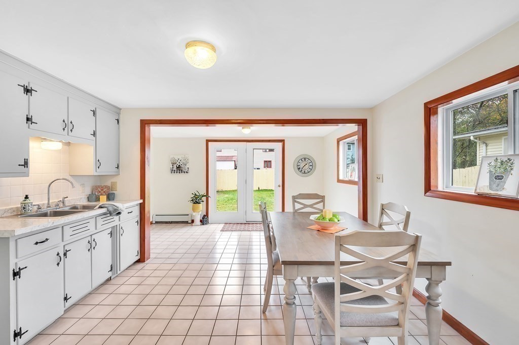 53 Merrill Road Springfield, MA 01119 - Photo 1 of 30 a view of a kitchen area with furniture and wooden floor