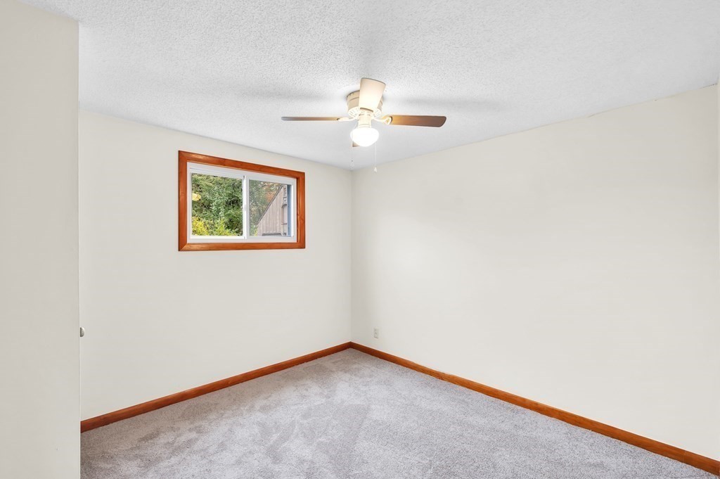 53 Merrill Road Springfield, MA 01119 - Photo 15 of 30 an empty room with windows and fan