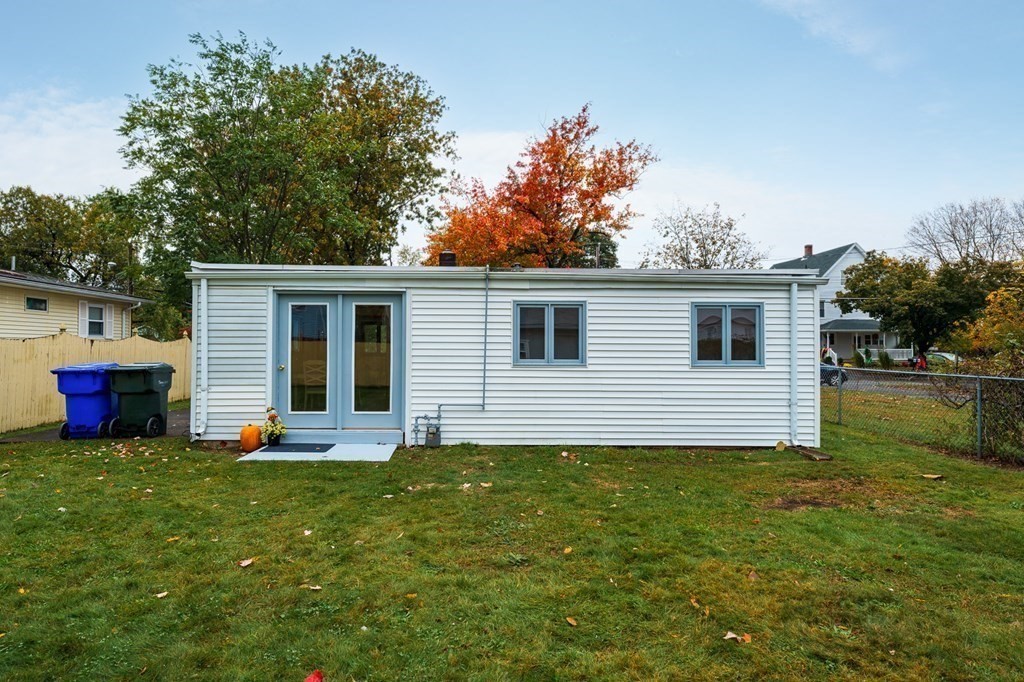 53 Merrill Road Springfield, MA 01119 - Photo 24 of 30 a front view of house with yard and trees in the background