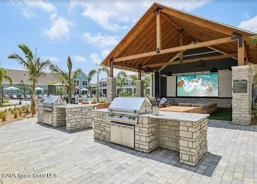 1073 Journey Circle, Unit 201 Rockledge, FL 32955 - Photo 3 of 10 a view of a dinning table and chair in the patio