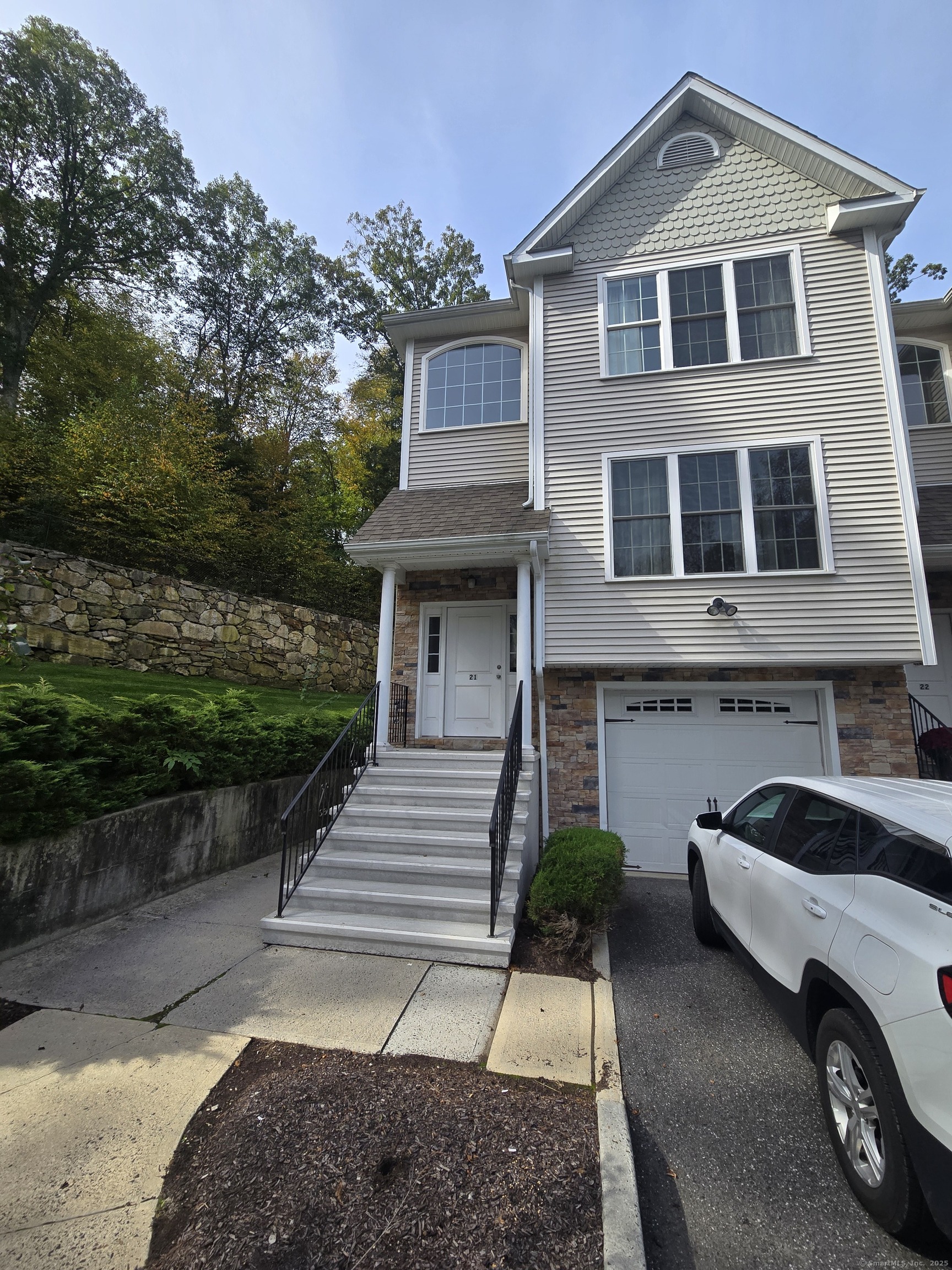 a view of a car parked in front of a house