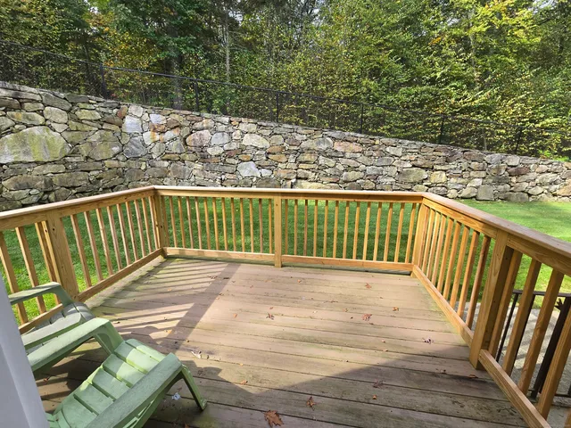 a view of balcony with wooden floor