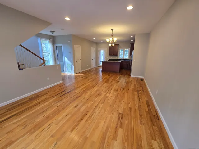 a view of kitchen and dining room with wooden floor