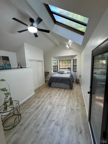 a room with furniture and a wooden floor