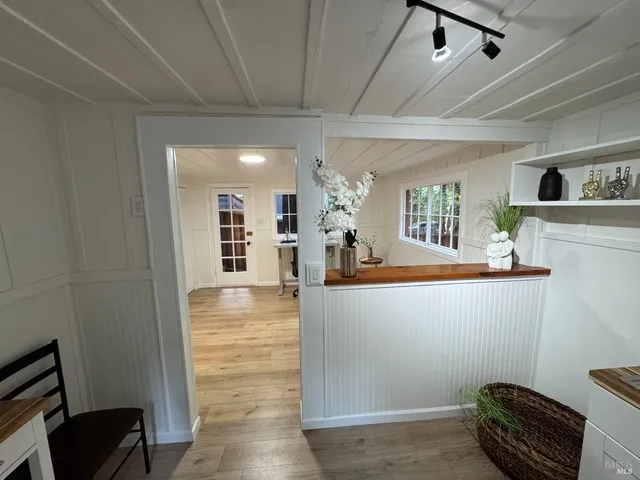 a view of kitchen and dining room with wooden floor
