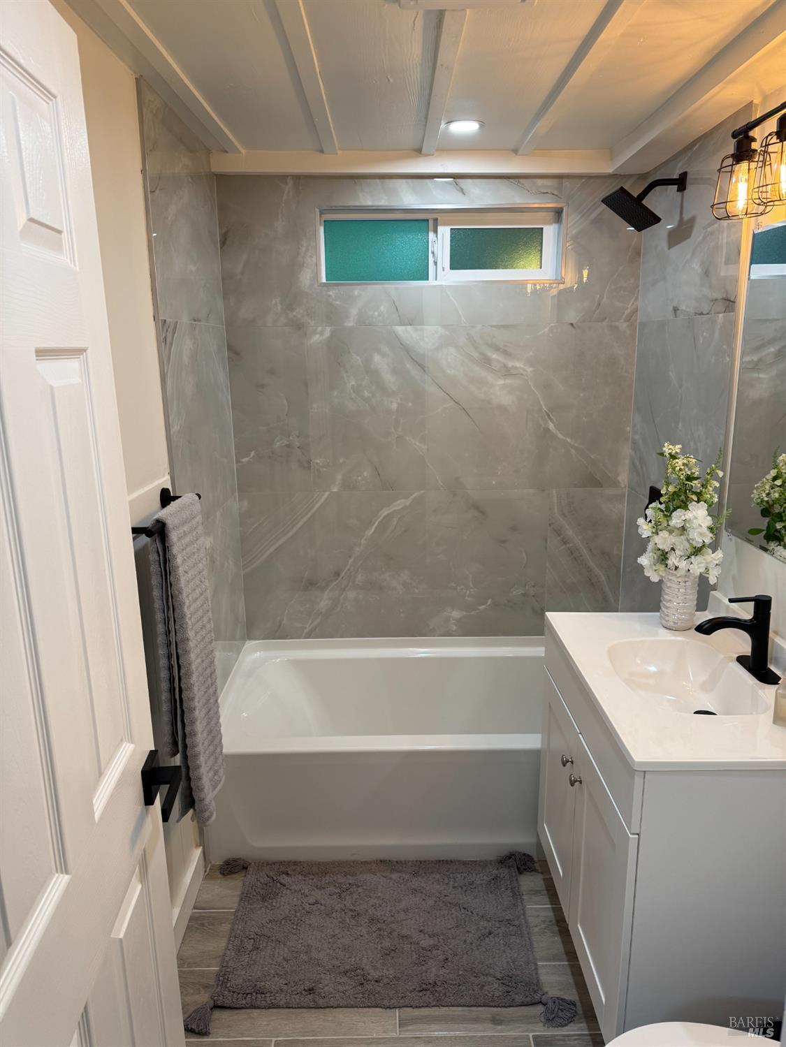 14652 Canyon 1 Road Guerneville, CA 95446 - Photo 9 of 14 a bathroom with a tub sink and mirror