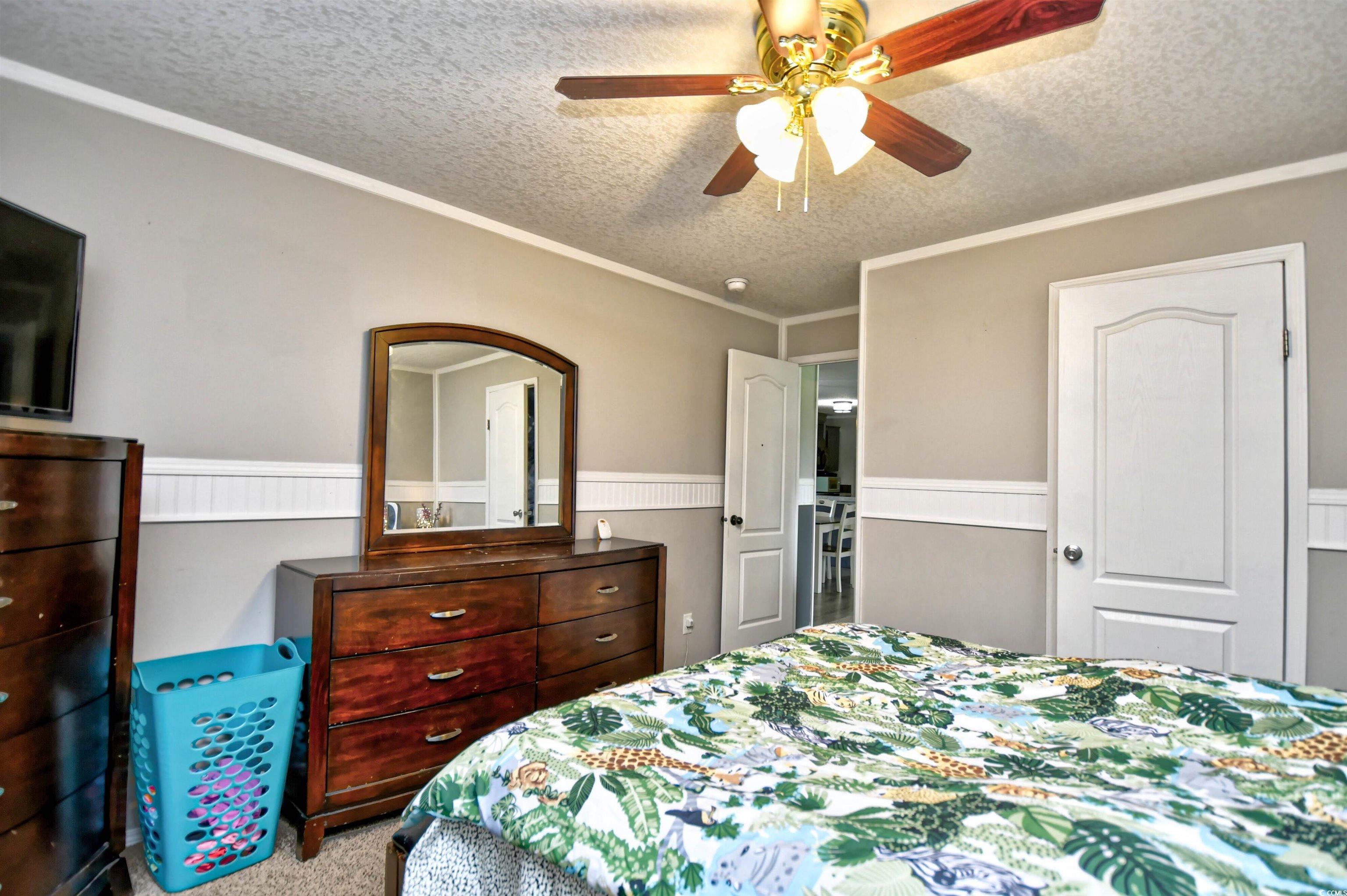 2296 Bakers Chapel Road Aynor, SC 29511 - Photo 21 of 28 Carpeted bedroom featuring crown molding, a textur