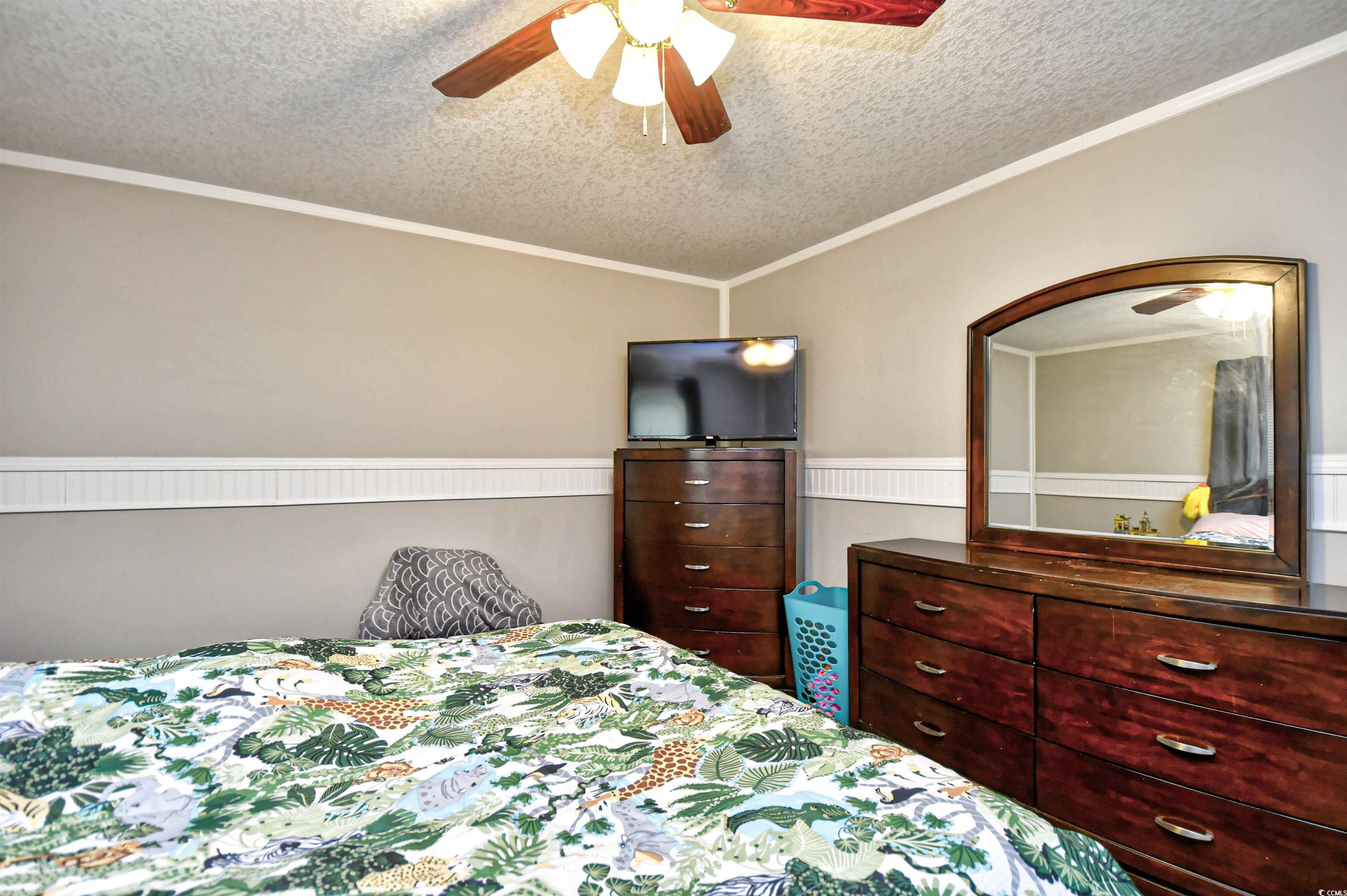 2296 Bakers Chapel Road Aynor, SC 29511 - Photo 22 of 28 Bedroom featuring a textured ceiling, ceiling fan,