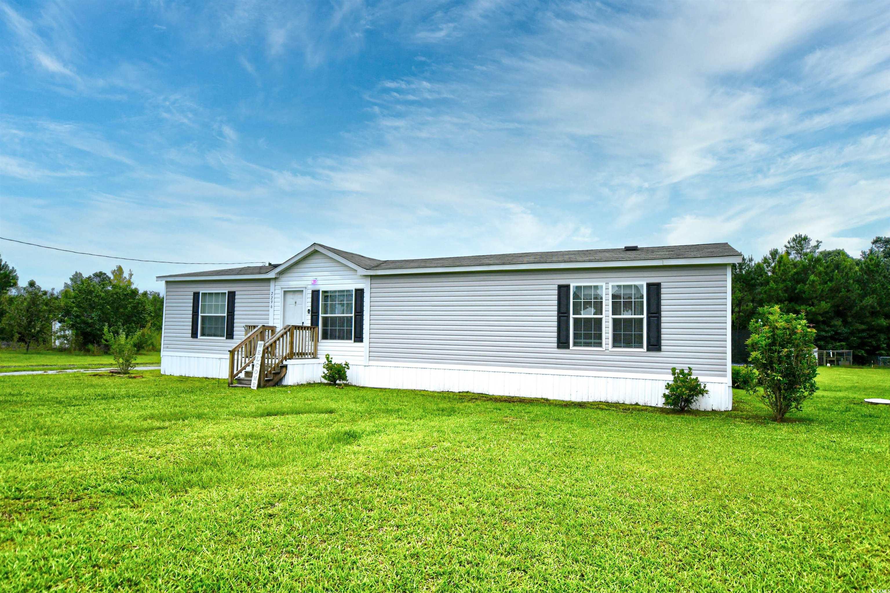 2296 Bakers Chapel Road Aynor, SC 29511 - Photo 3 of 28 Manufactured / mobile home featuring a front yard