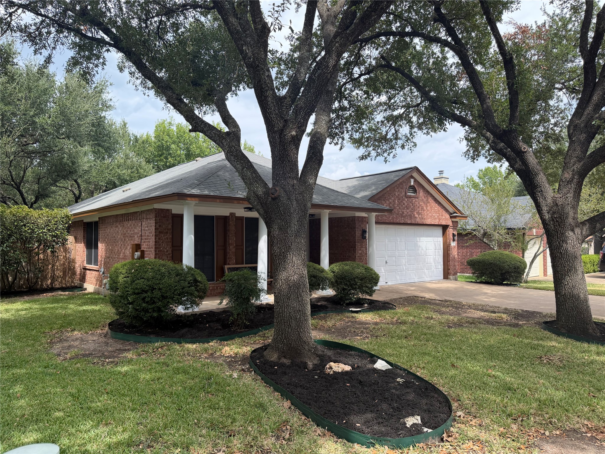 4604 Ramies Run Austin, TX 78749 - Photo 1 of 38 Mature trees shade the classic brick exterior and welcoming front porch of this charming home.