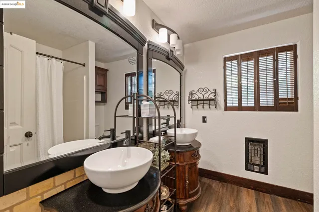 a view of a balcony with furniture and wooden floor