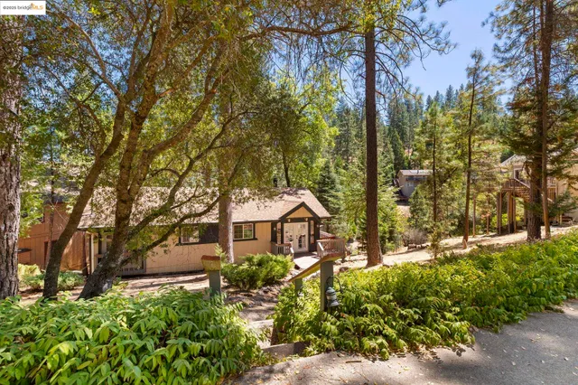 a kitchen with stainless steel appliances granite countertop a stove and cabinets