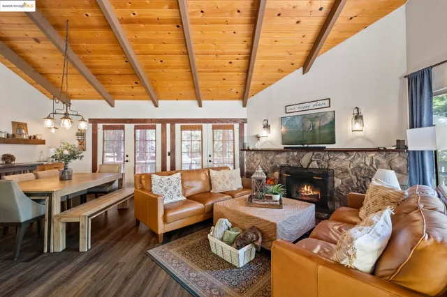 a living room with furniture wooden floor and next to a window