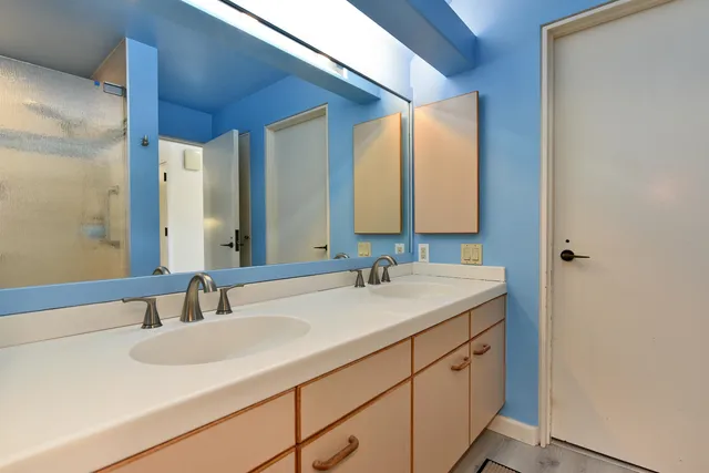 a bathroom with a sink and a mirror
