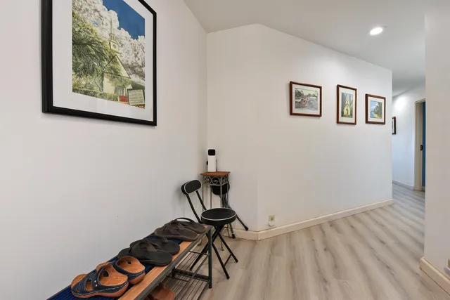 a view of workspace with wooden floor