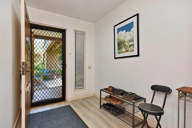 a view of room with furniture and a window