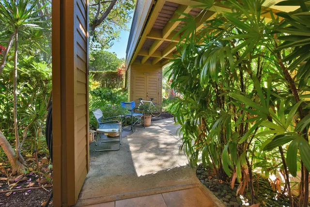 a view of a pathway with a yard