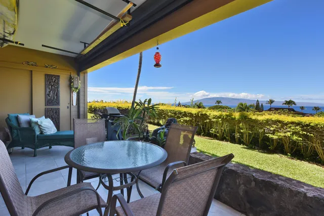 a view of balcony with furniture and garden