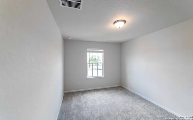 an empty room with window