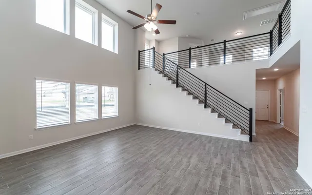 a view of an entryway with wooden floor and stairs