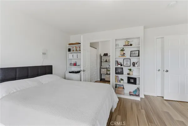 a bedroom with a bed and closet