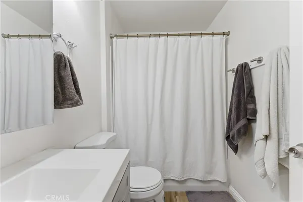 a view of parking garage with cars parked