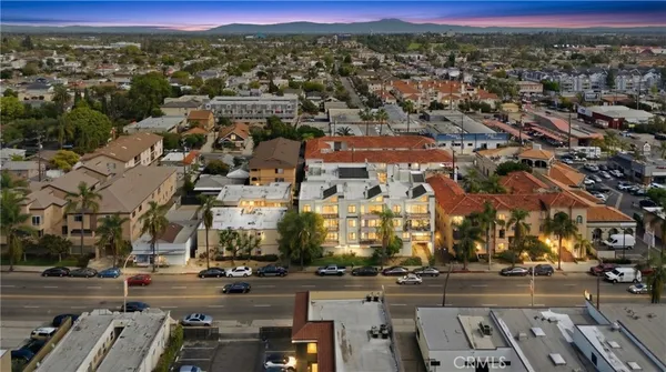 a view of a chairs and table in patio with a lake view