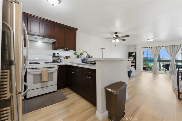 a kitchen with a sink appliances and cabinets