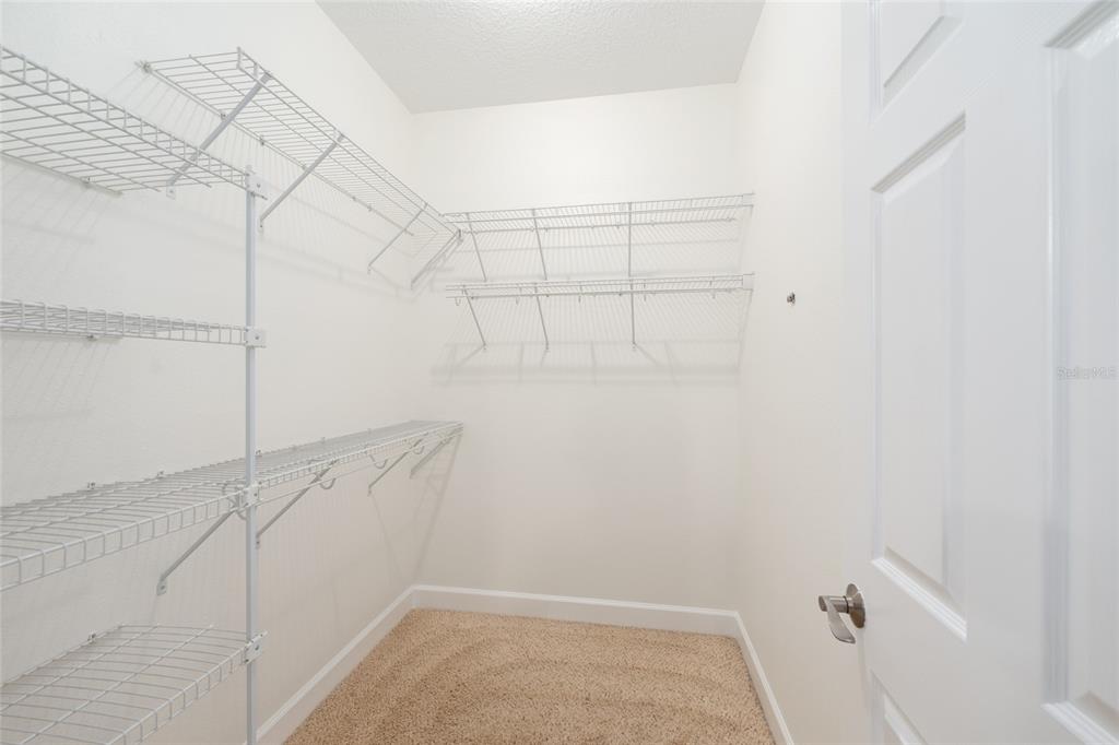 4735 Southeast 112th Street Road Belleview, FL 34420 - Photo 37 of 73 a view of a room with racks on the wall