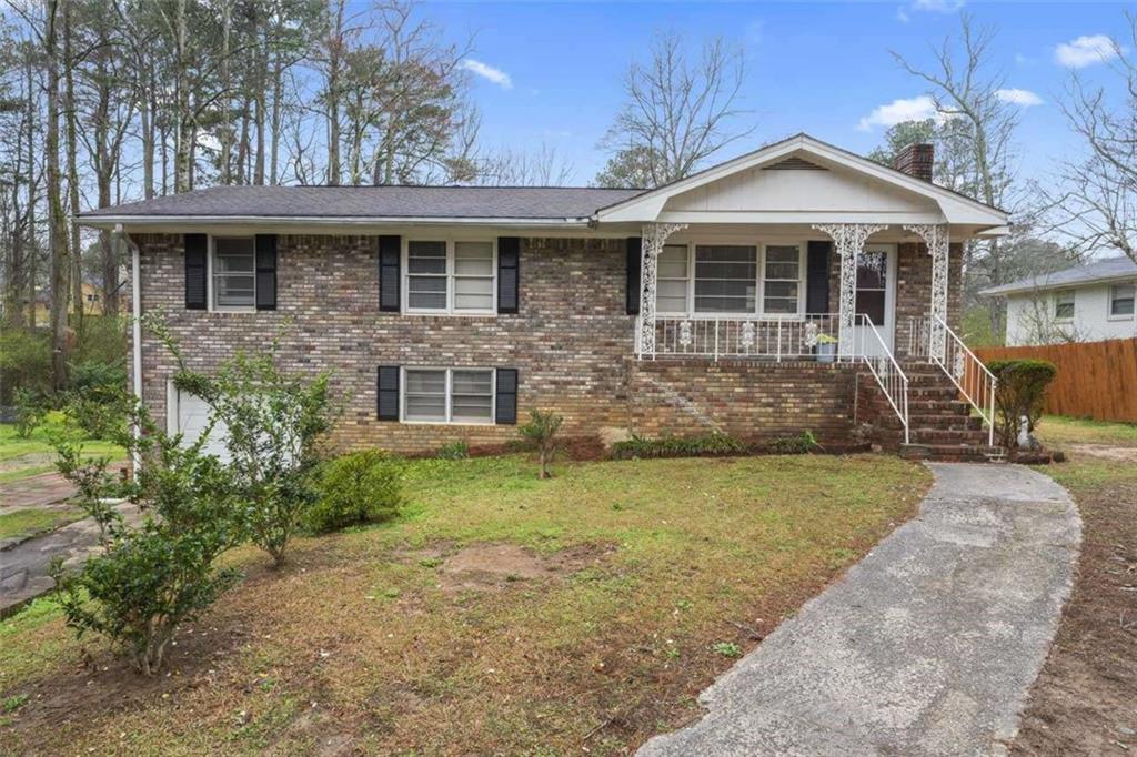 3070 New MacLand Road Powder Springs, GA 30127 - Photo 1 of 1 a front view of a house with garden