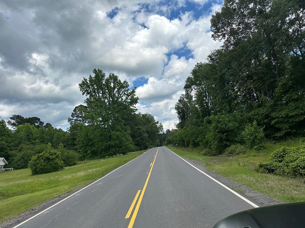 0 Johns Gin Road Keithville, LA 71047 - Photo 4 of 6 a view of a green field with wooden fence