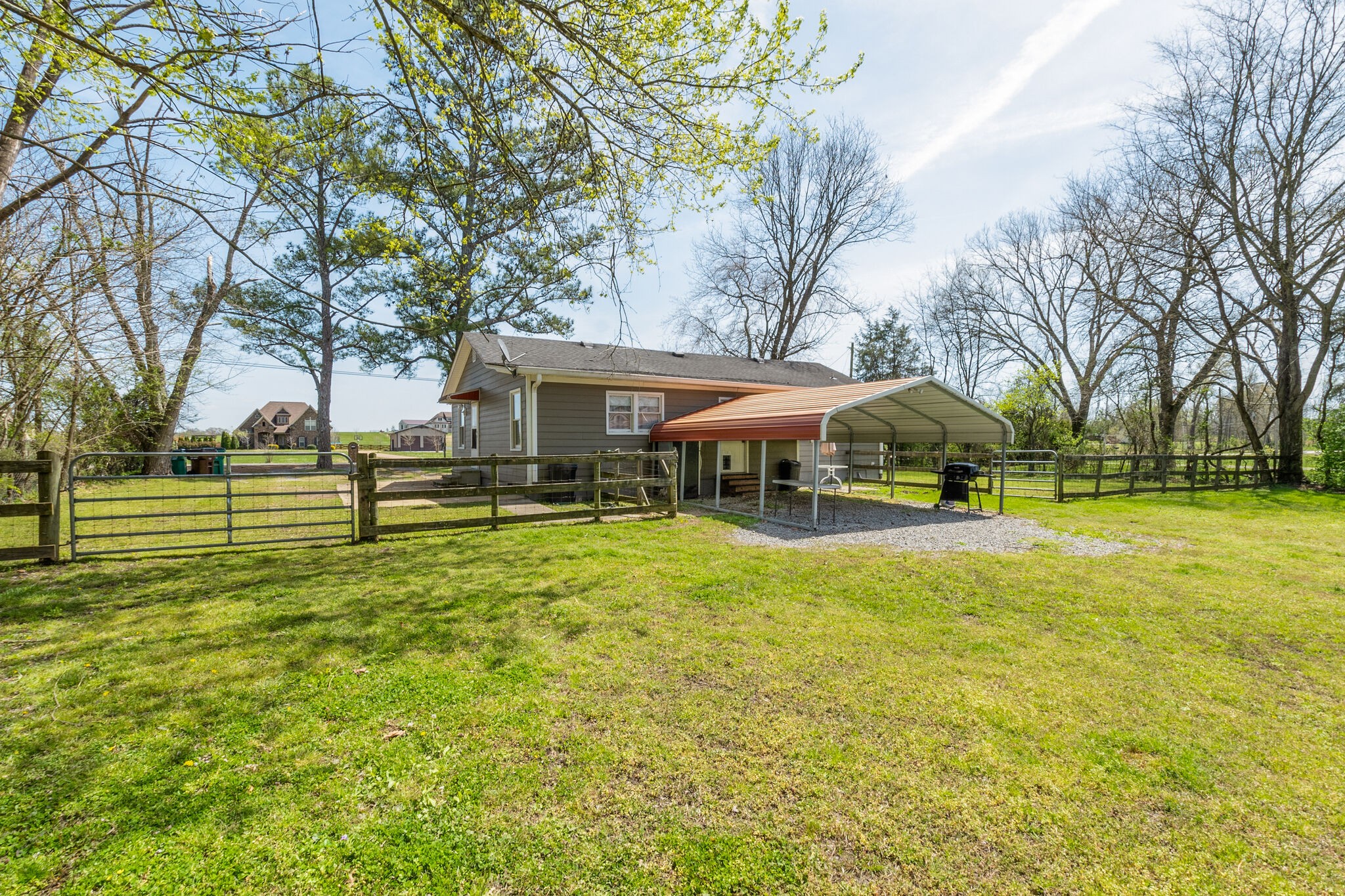 2491 Double Log Cabin Road Lebanon, TN 37087 - Photo 27 of 31 a view of a swimming pool and trees in the background