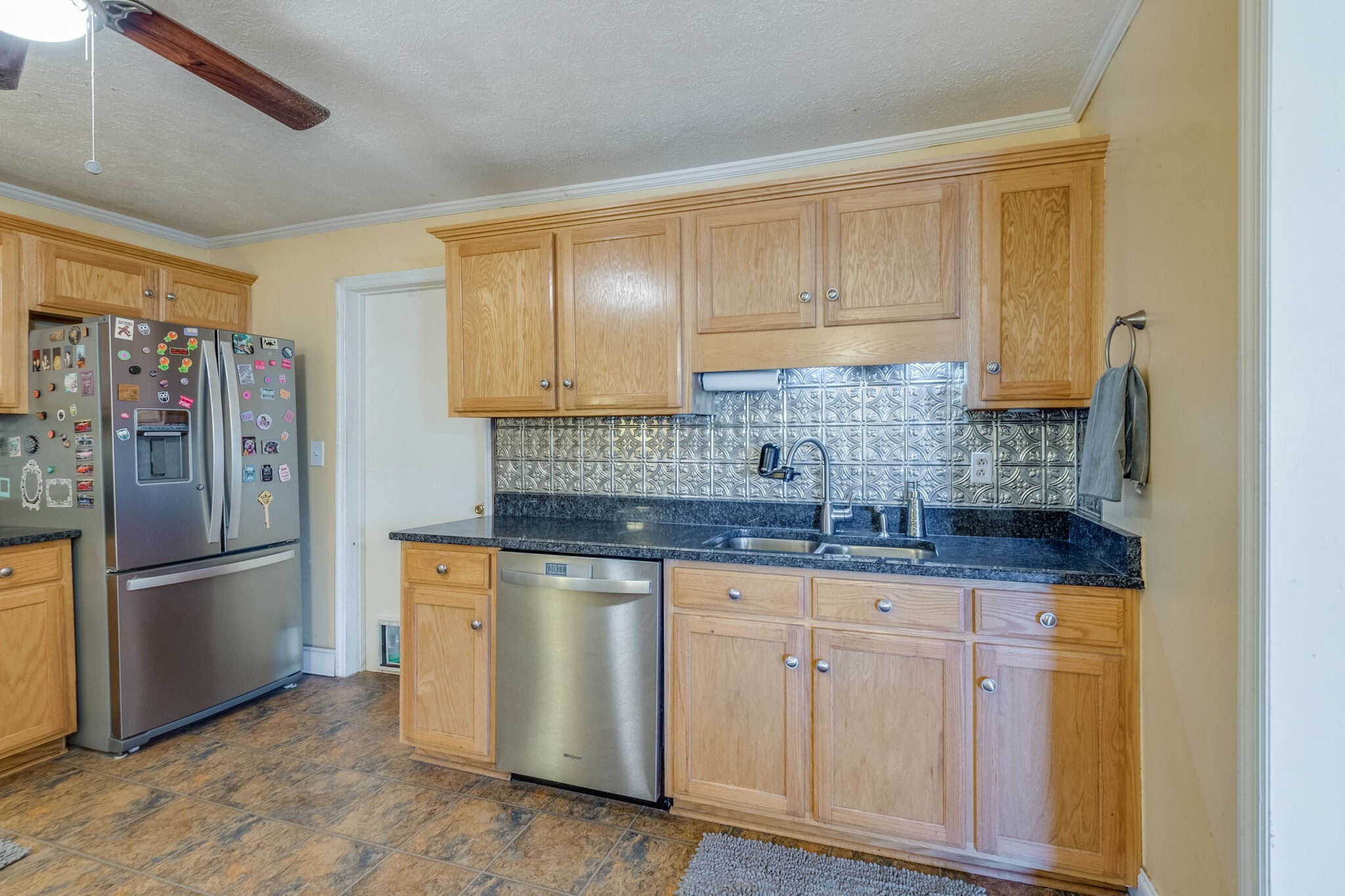 2491 Double Log Cabin Road Lebanon, TN 37087 - Photo 10 of 31 a kitchen with granite countertop a refrigerator and a sink