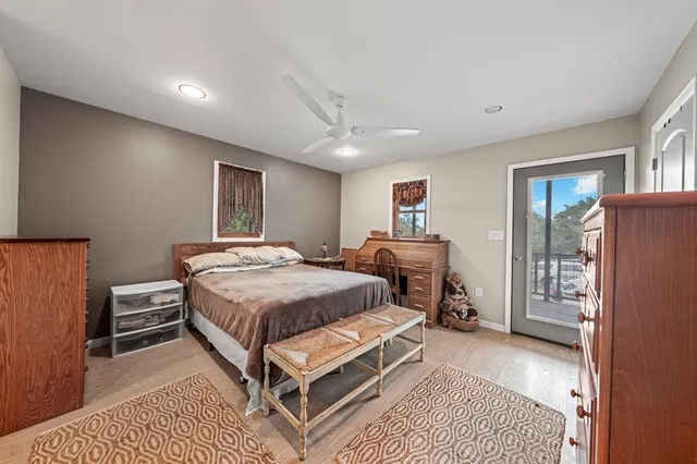 a bathroom with a sink a mirror a vanity and a shower