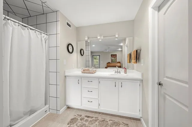 a bathroom with a sink and cabinets