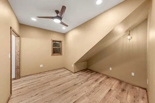 a bedroom with a bed and a table in it