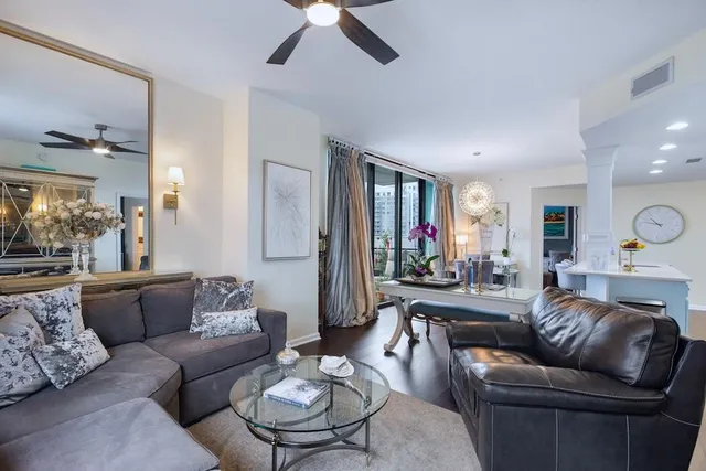 a living room with furniture or couch and a dining table