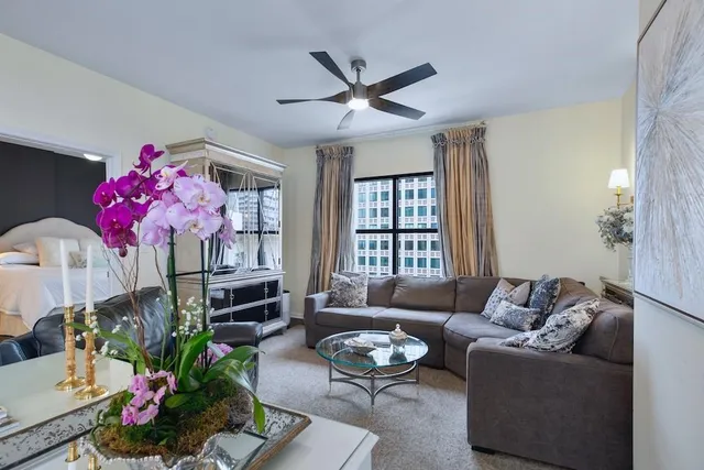 a living room with furniture and a window
