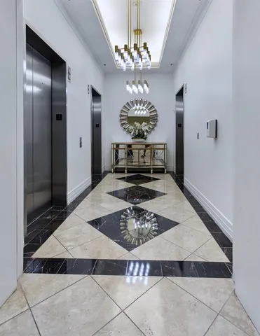 a very nice looking dining room with a table and chandelier