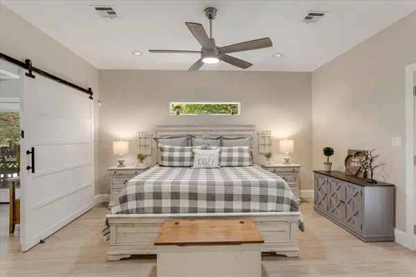 a bedroom with a bed and a cabinets