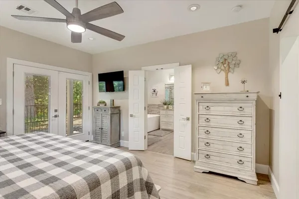 a bedroom with a bed and a dresser