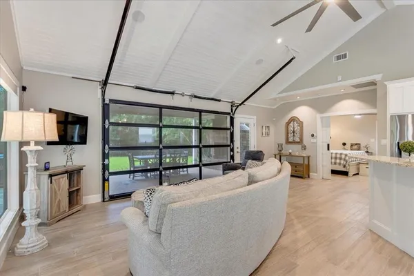 a living room with fireplace furniture and a flat screen tv